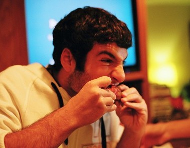 man eating tough meat